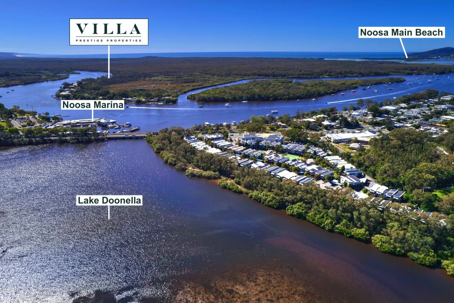 Finished drone photo over Lake Doonella, Noosa, labelled with Noosa Marina, Noosa Main Beach and the agency logo